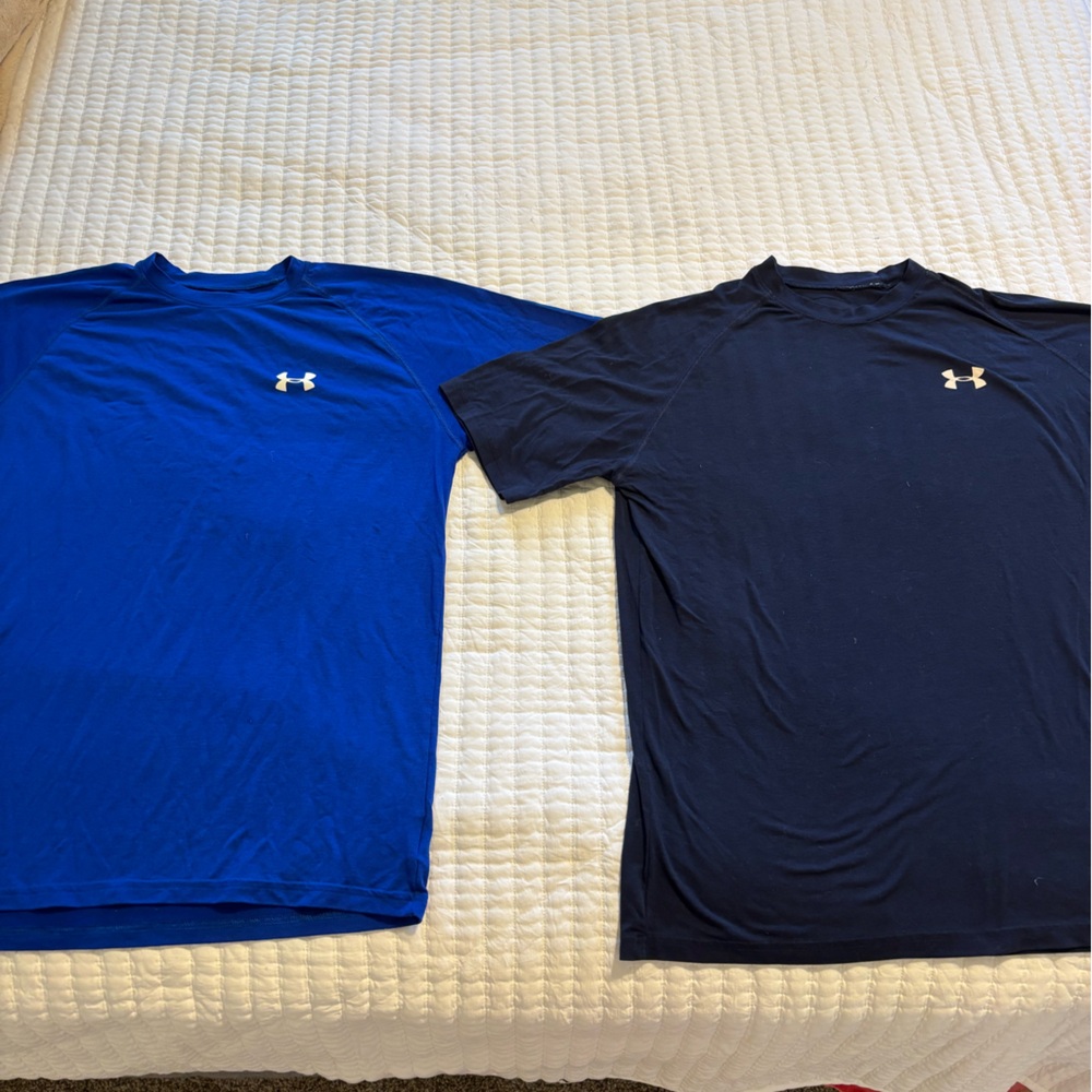 Under Armour shirts. Two shirts.
Navy and Blue.
Size small